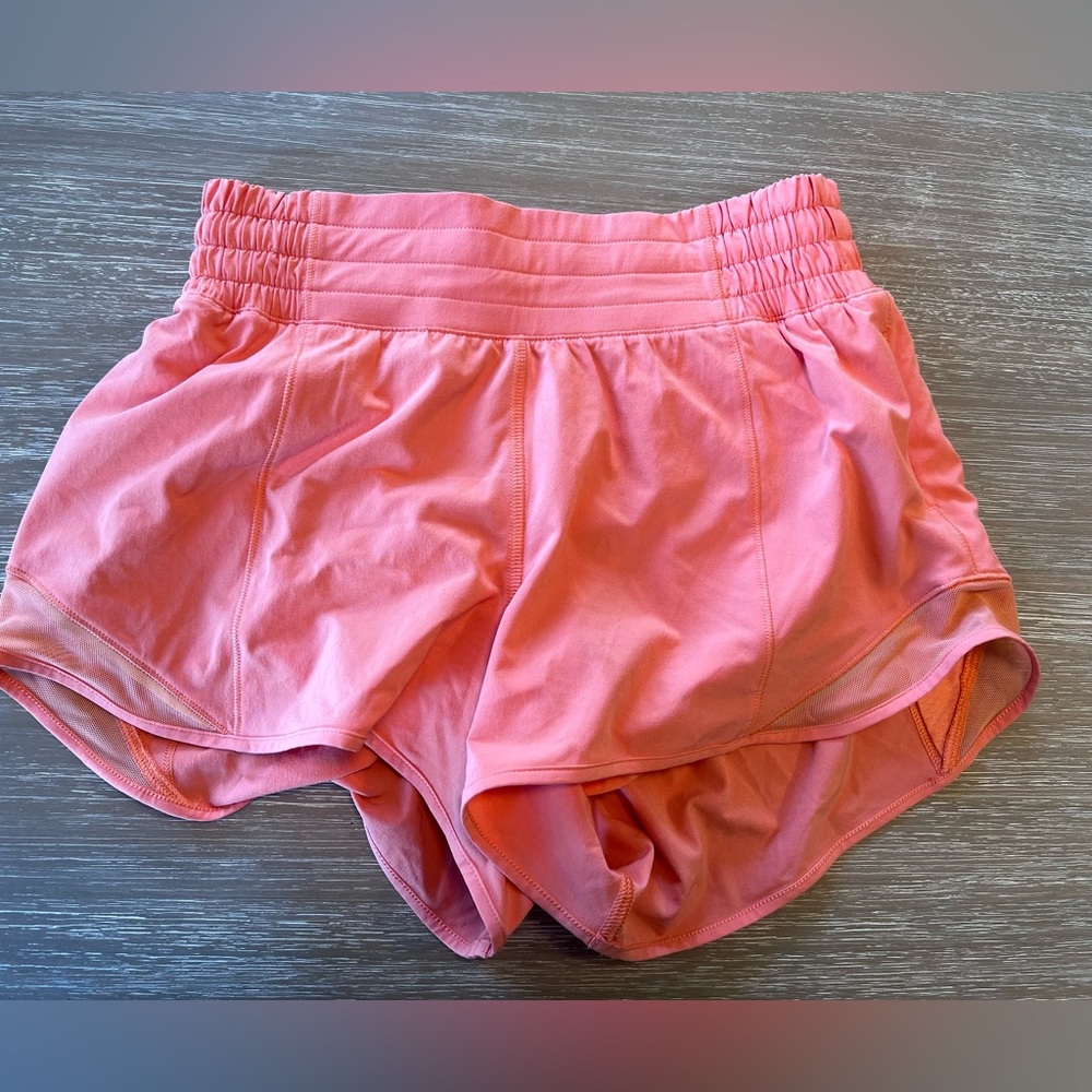 Lululemon Hotty Hot 4 inch shorts in orange color size 4